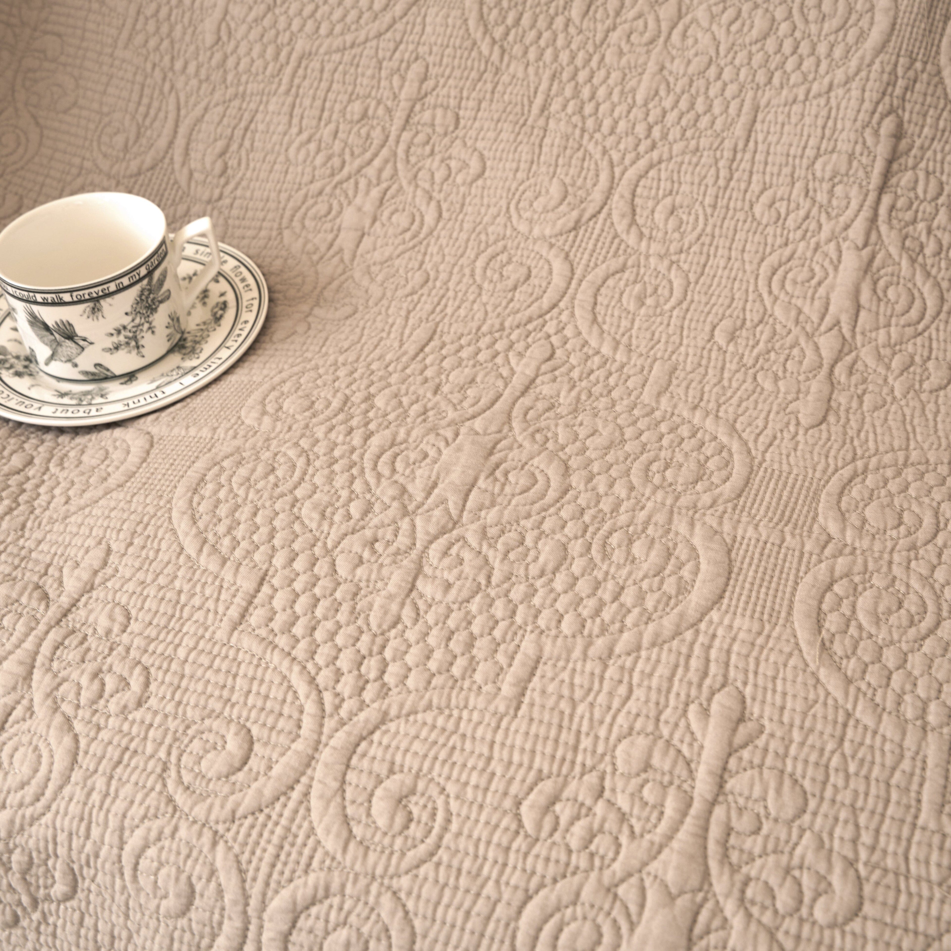 DaDa Bedding Elegant Fringed Cotton Quilted Throw Blanket - Luxurious Solid Soft Paisley Pattern, Cozy Lightweight Lap Throw, Perfect for Couch or Bed, Neutral Sandy Taupe Tan Beige, 50x60 Inches